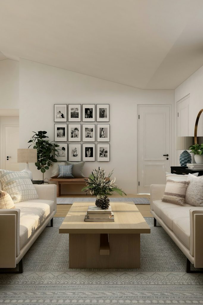 Staged living room with neutral sofas and a coffee table